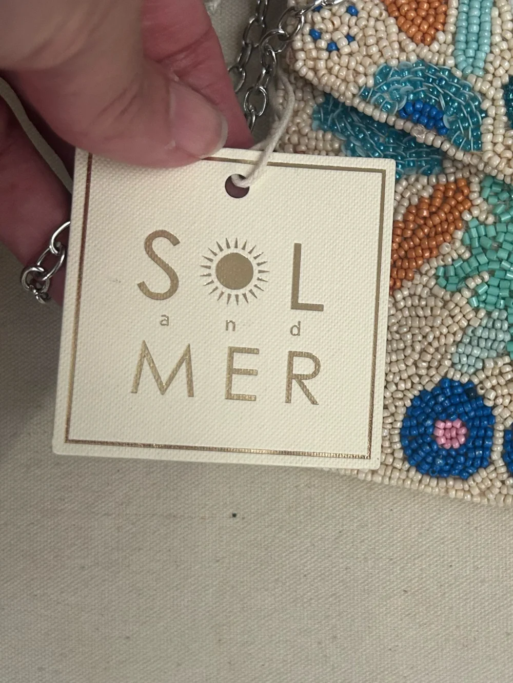 NWT SOL and MER beaded clutch.